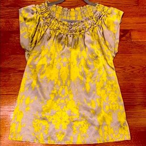 Gray and yellow blouse.